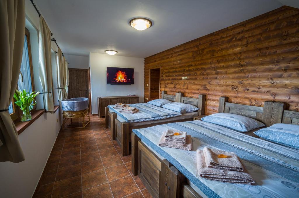 Postel nebo postele na pokoji v ubytování Ranch Jestřebice