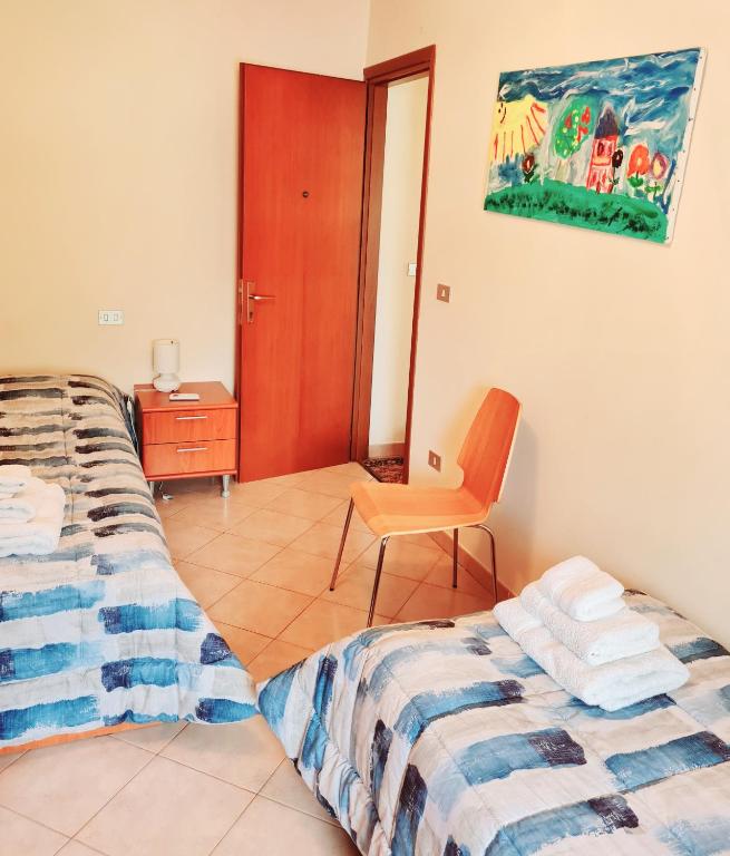 Posteľ alebo postele v izbe v ubytovaní Casa Colonna Montegrotto terme