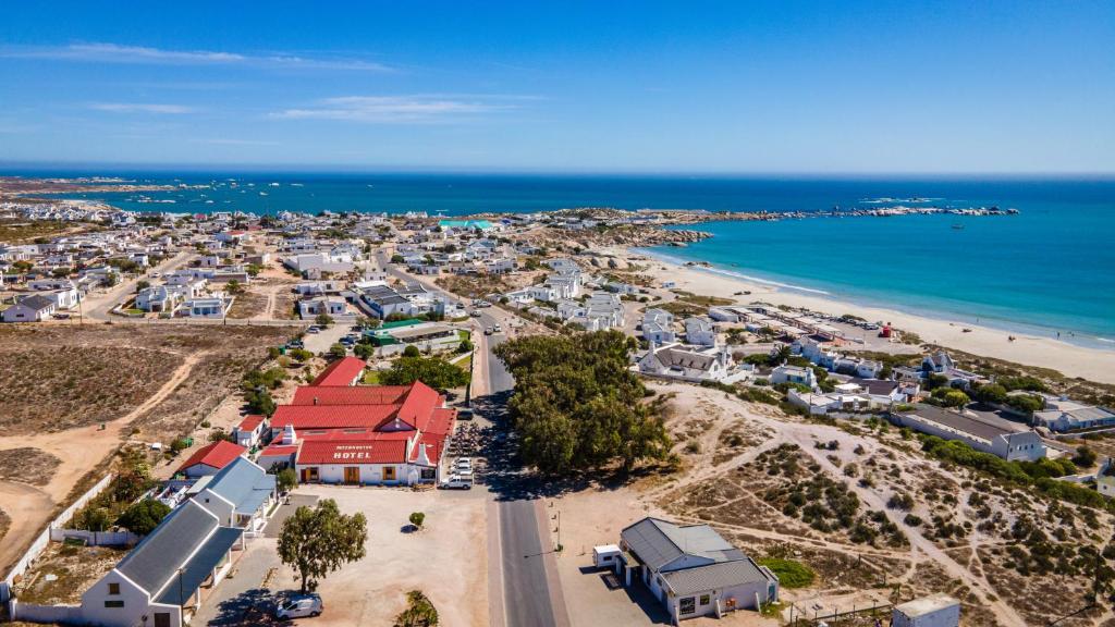 an aerial view of a town and the beach at Paternoster Hotel in Paternoster