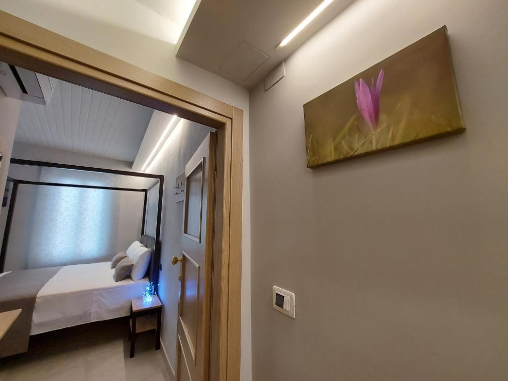Posteľ alebo postele v izbe v ubytovaní Casa Vacanze Piccolpasso 20