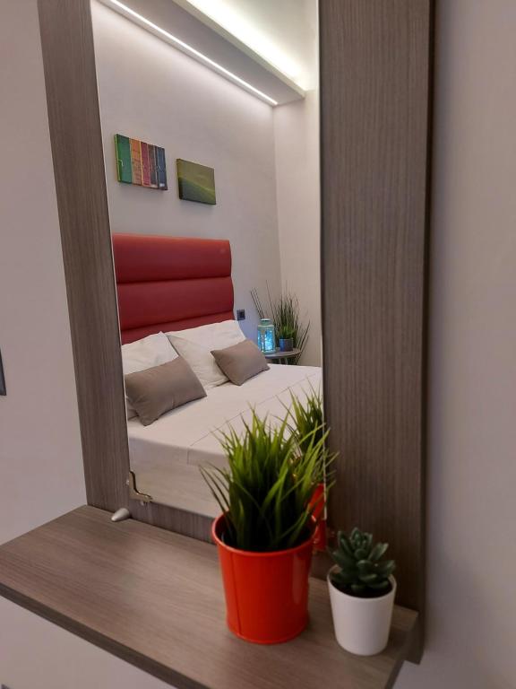 Posteľ alebo postele v izbe v ubytovaní Casa Vacanze Piccolpasso 20