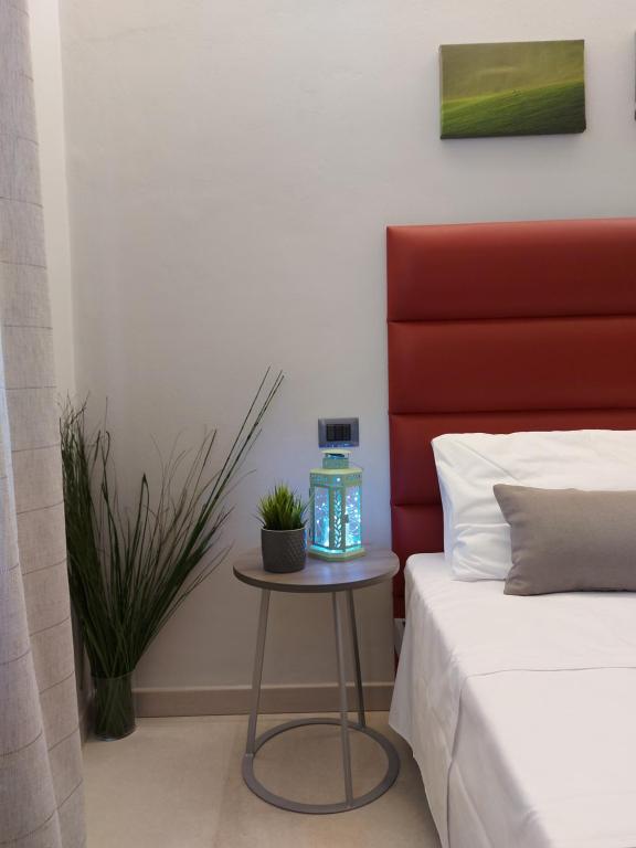 Posteľ alebo postele v izbe v ubytovaní Casa Vacanze Piccolpasso 20