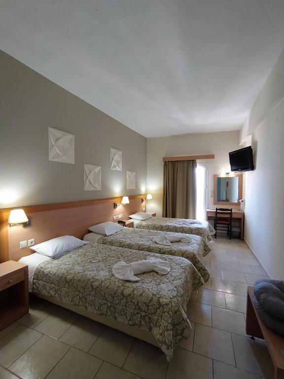 Postel nebo postele na pokoji v ubytování Plaz Hotel