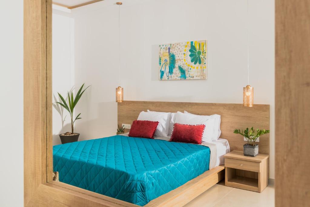 Postel nebo postele na pokoji v ubytování Aphrodite Studios & Suites
