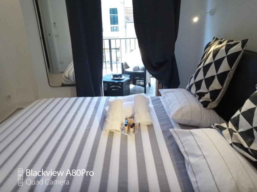 Posteľ alebo postele v izbe v ubytovaní Dimora50 Apartament