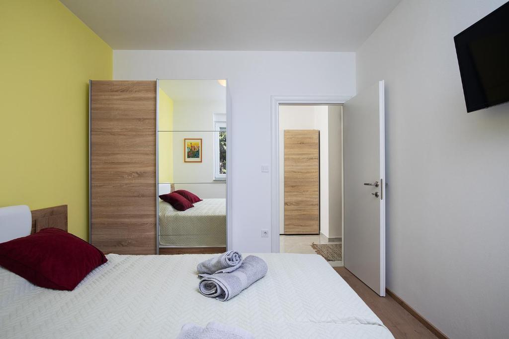 Postel nebo postele na pokoji v ubytování Apartments Jan&Enzo