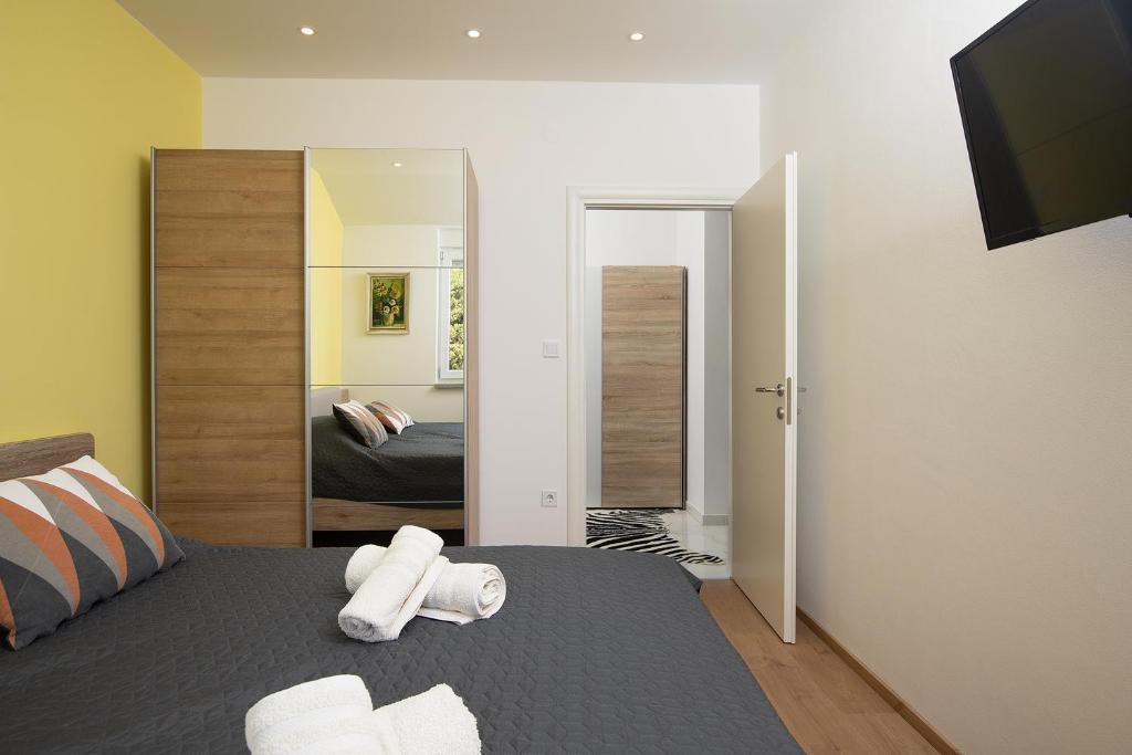 Postel nebo postele na pokoji v ubytování Apartments Jan&Enzo