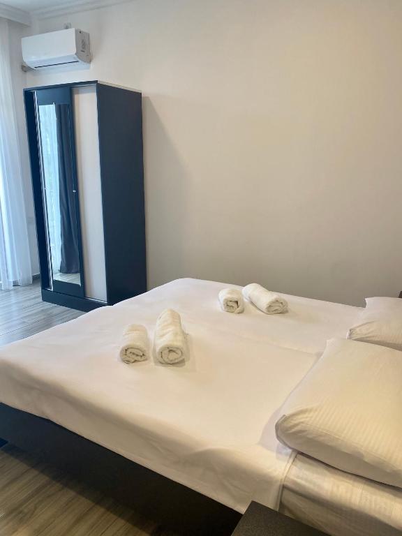 Postel nebo postele na pokoji v ubytování Hotel Niko