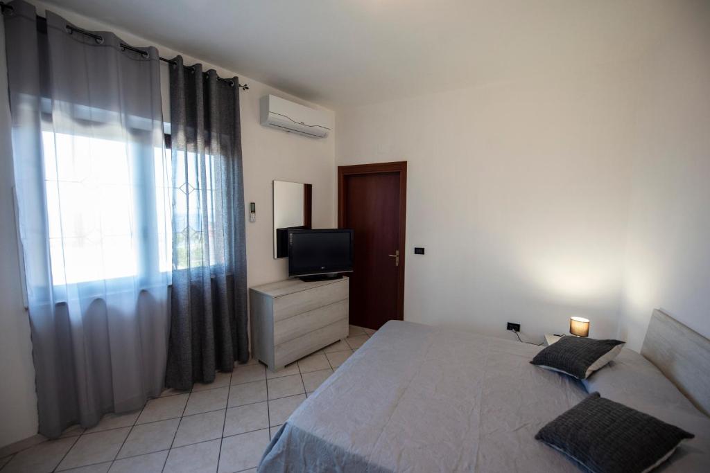 Łóżko lub łóżka w pokoju w obiekcie B&B Esterita