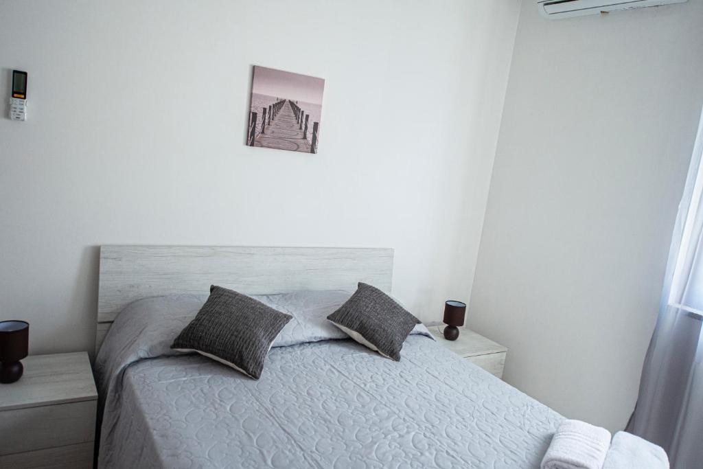 Łóżko lub łóżka w pokoju w obiekcie B&B Esterita