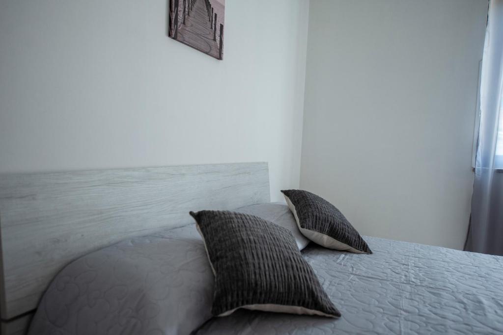 Łóżko lub łóżka w pokoju w obiekcie B&B Esterita