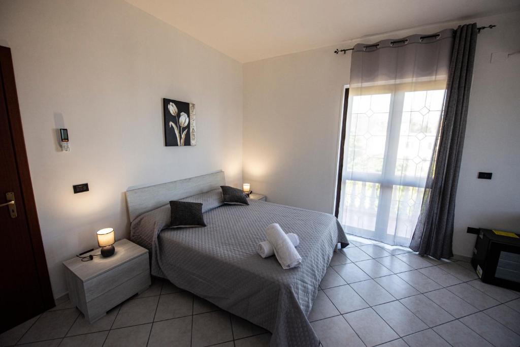 Łóżko lub łóżka w pokoju w obiekcie B&B Esterita