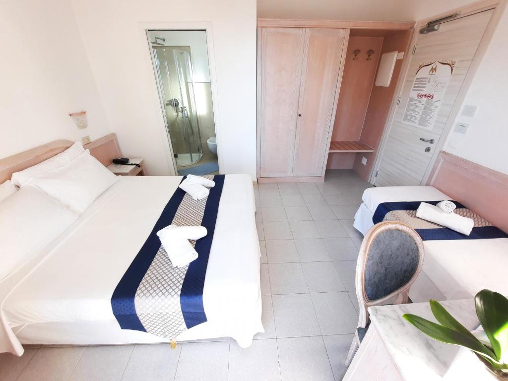 Postel nebo postele na pokoji v ubytování Hotel Margherita