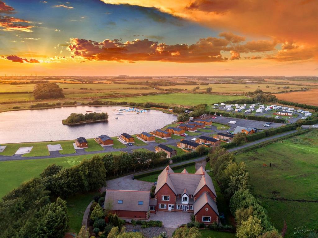 an aerial view of a village next to a river at Ream Hills Holiday Park in Blackpool