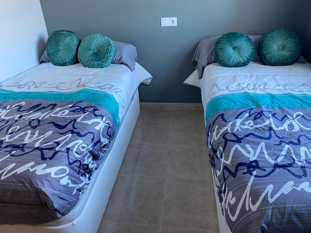 Posteľ alebo postele v izbe v ubytovaní Apartamento Calypso Inmomart