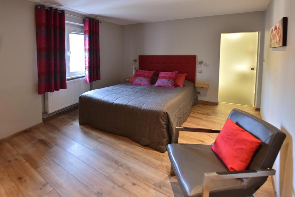 Postel nebo postele na pokoji v ubytování Hôtel de l'Ange