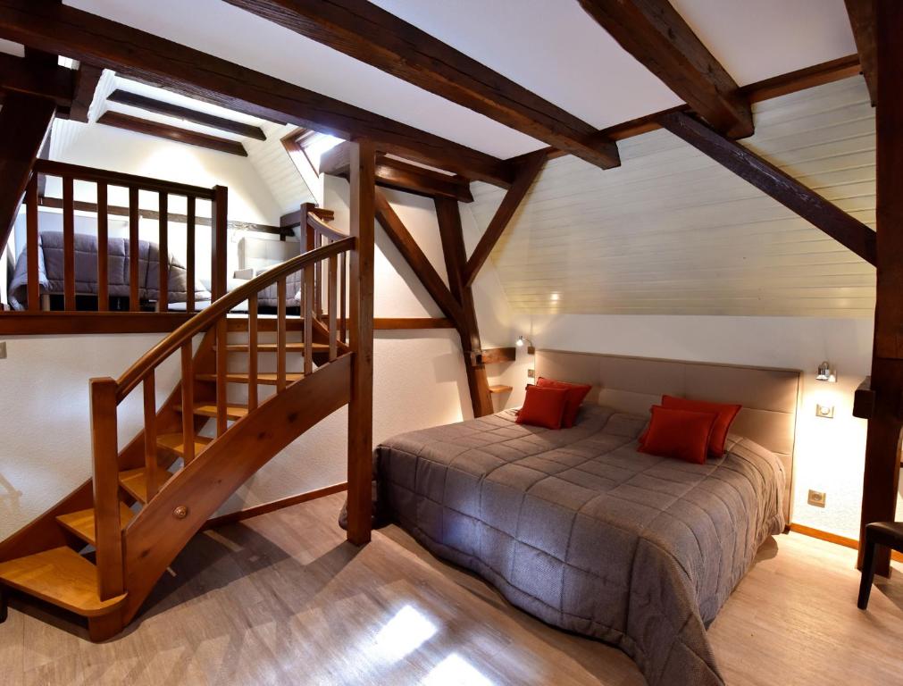 Postel nebo postele na pokoji v ubytování Hôtel de l'Ange