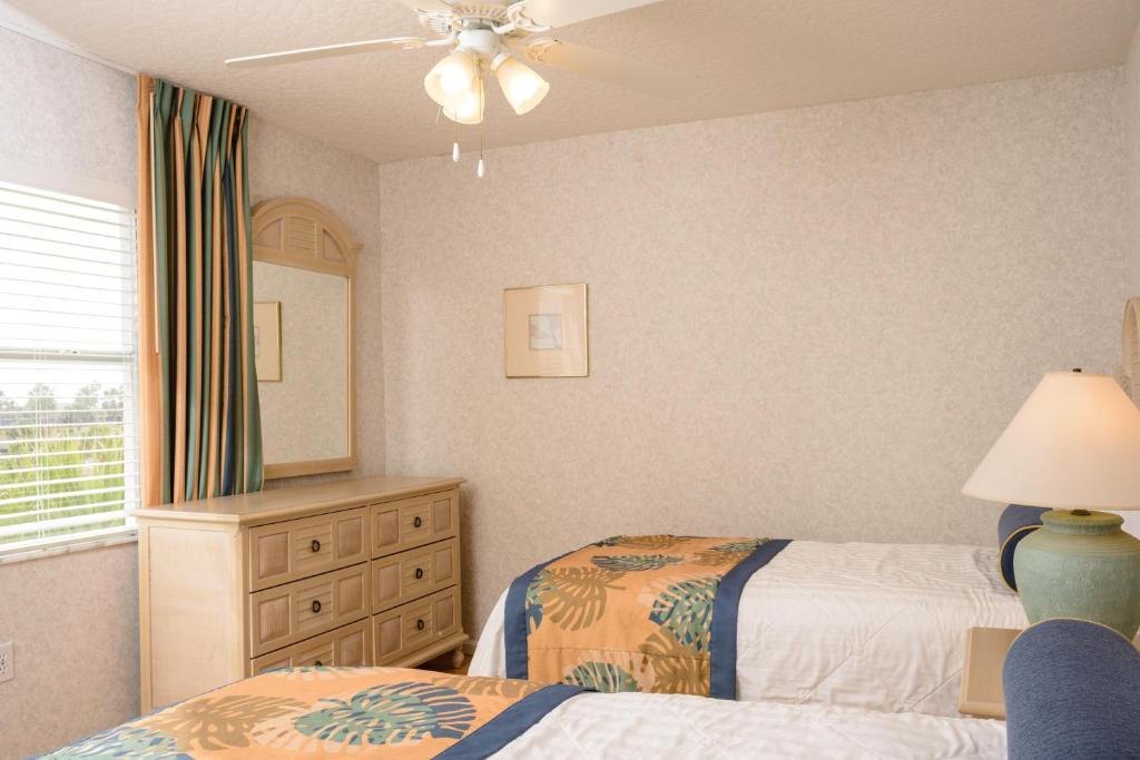 Postel nebo postele na pokoji v ubytování Discovery Beach Resort