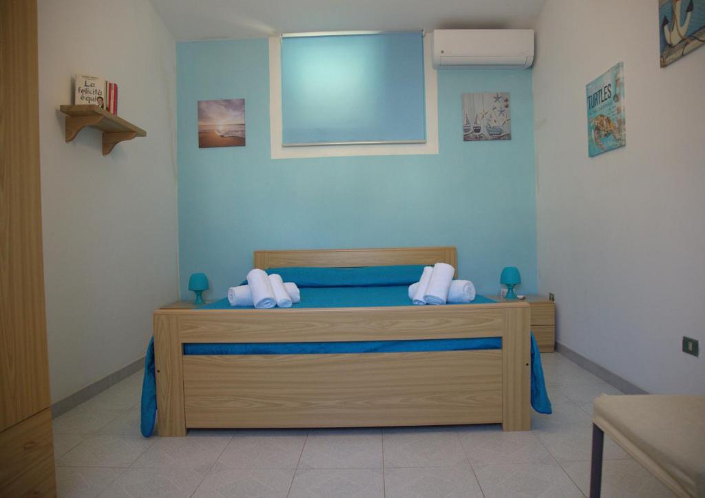 A bed or beds in a room at Giulymar