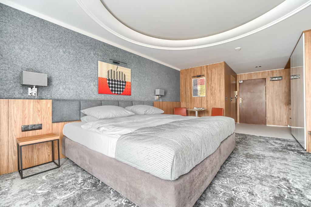 Posteľ alebo postele v izbe v ubytovaní City Apartments - Młyńska 49