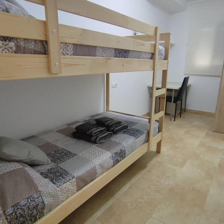 A bed or beds in a room at Somnis del Delta