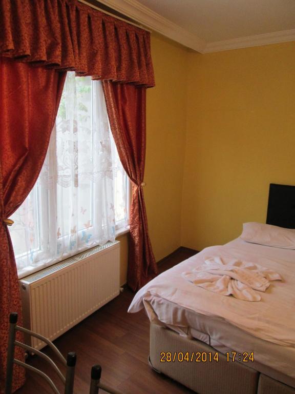 Postel nebo postele na pokoji v ubytování Bereket traveler Hotel