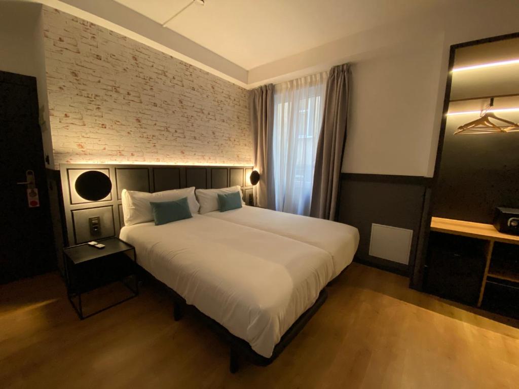 Postel nebo postele na pokoji v ubytování BYPILLOW San Mamés
