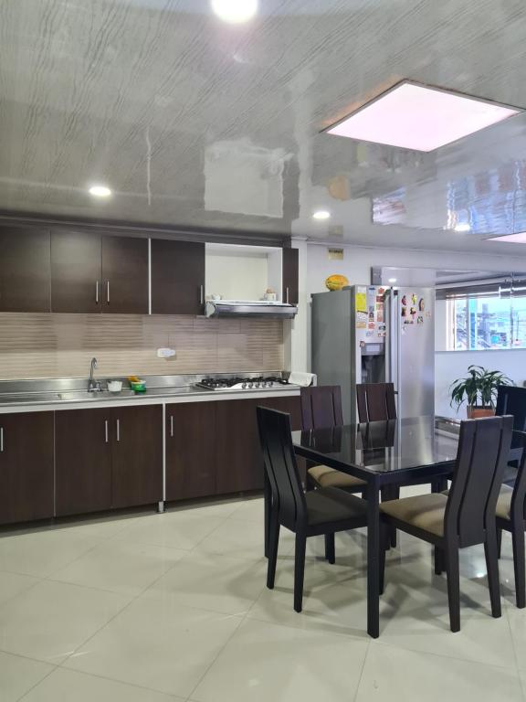 Kuchyň nebo kuchyňský kout v ubytování Hotel Casa Huesped Kiwi