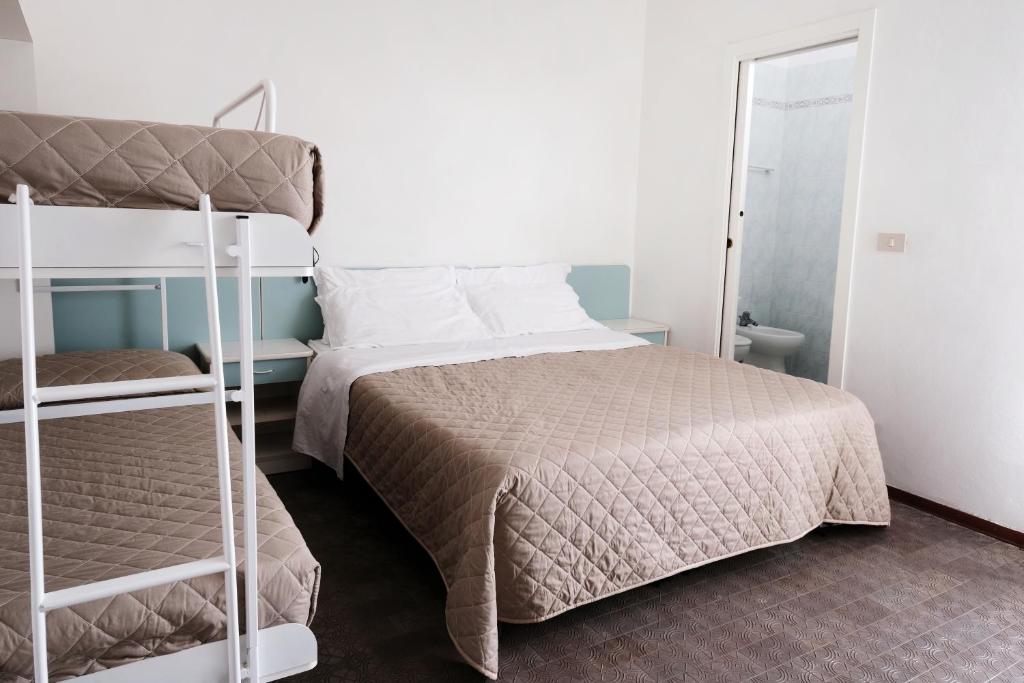 Postel nebo postele na pokoji v ubytování Hotel Continental