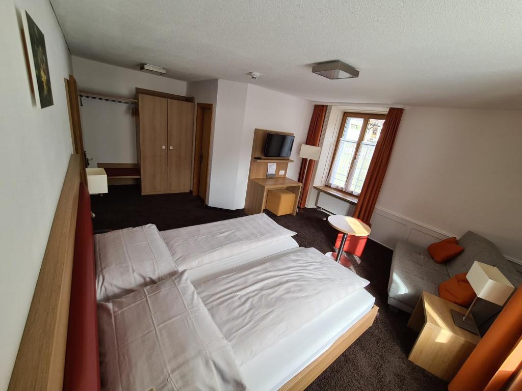 Postel nebo postele na pokoji v ubytování Hotel Stätzerhorn