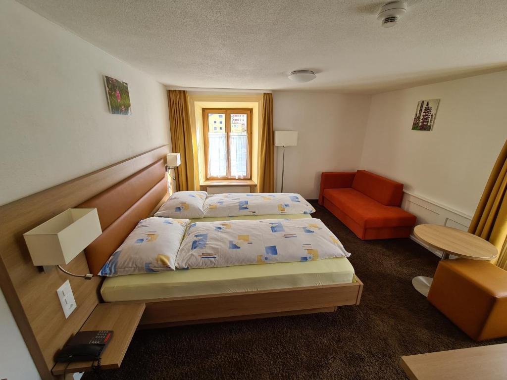 Postel nebo postele na pokoji v ubytování Hotel Stätzerhorn