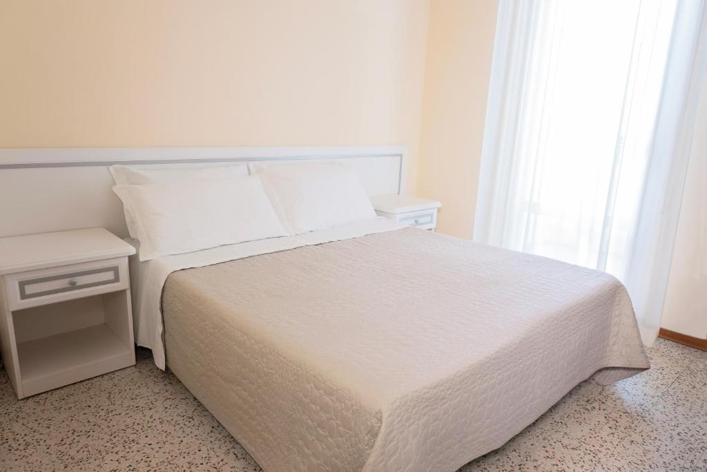 Postel nebo postele na pokoji v ubytování Hotel Continental