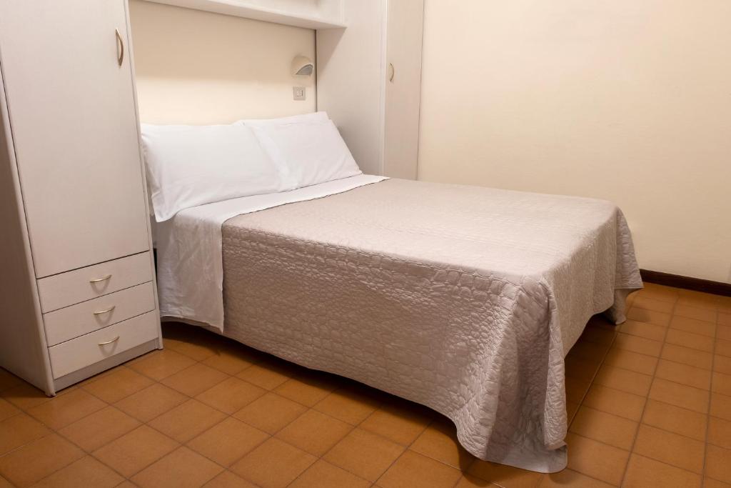 Postel nebo postele na pokoji v ubytování Hotel Continental