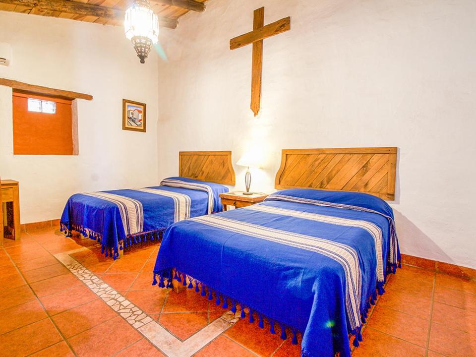 Postel nebo postele na pokoji v ubytování Hotel Mi Pueblito Tapalpa