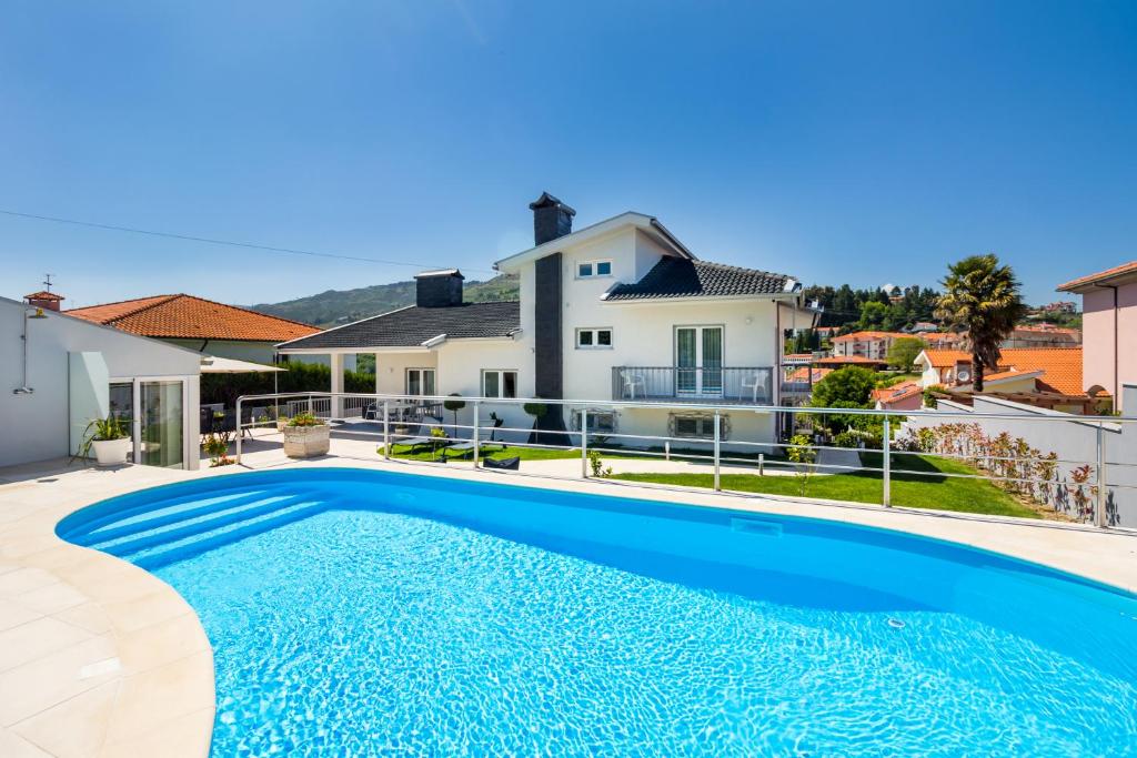 a swimming pool in the backyard of a house at Casa de Monsanto | Lamego in Lamego