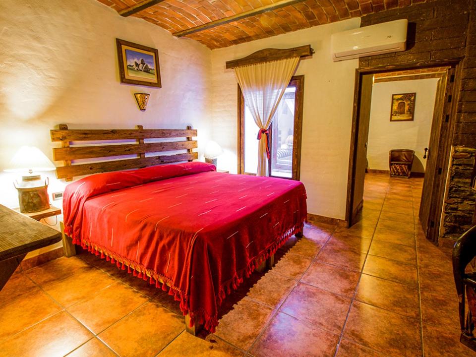 Postel nebo postele na pokoji v ubytování Hotel Mi Pueblito Tapalpa