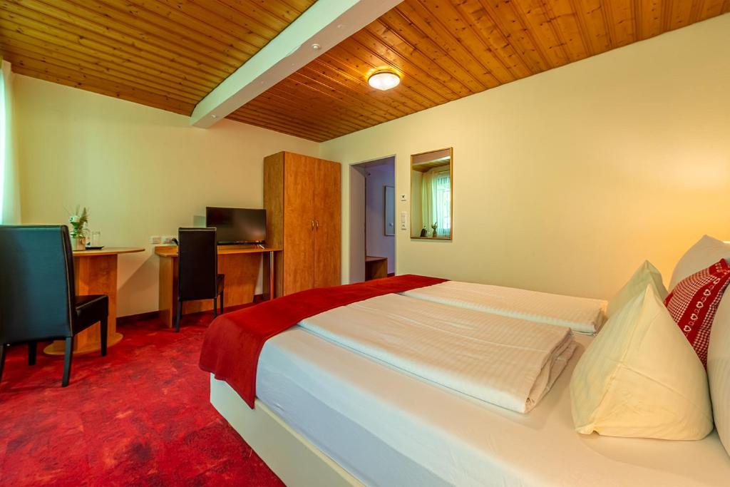 Postel nebo postele na pokoji v ubytování Hotel Neudeck