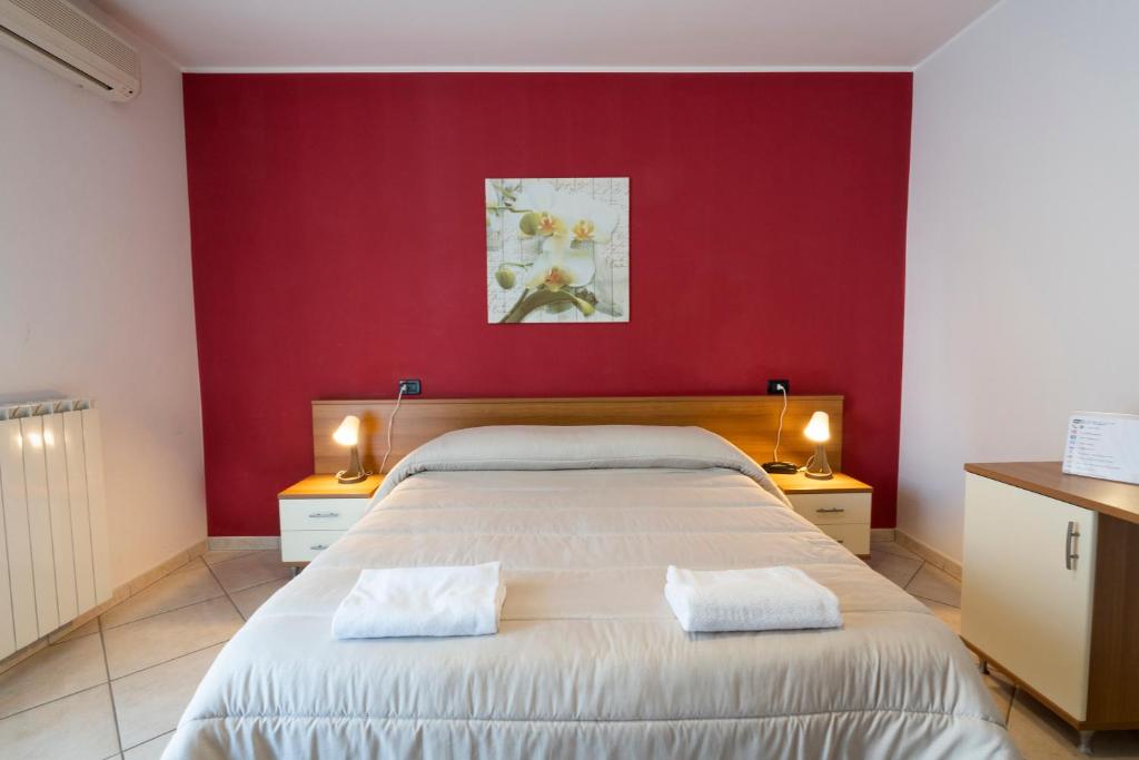 Postel nebo postele na pokoji v ubytování Hotel D'Atri