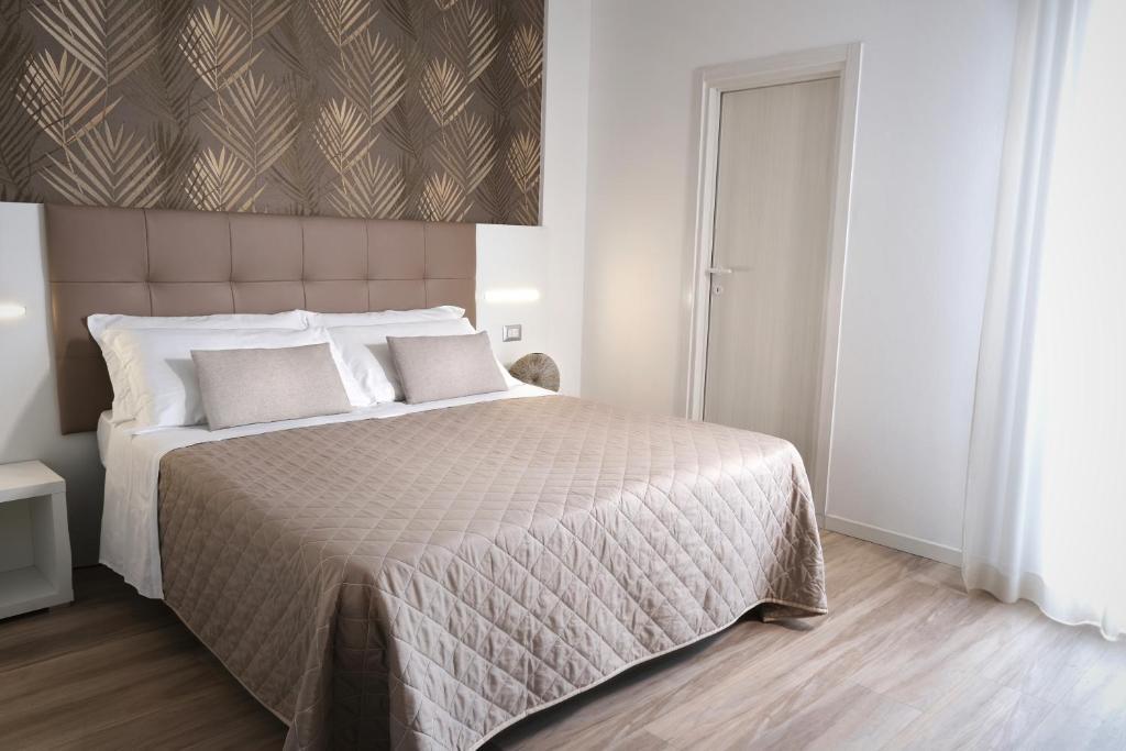 Postel nebo postele na pokoji v ubytování Hotel Continental