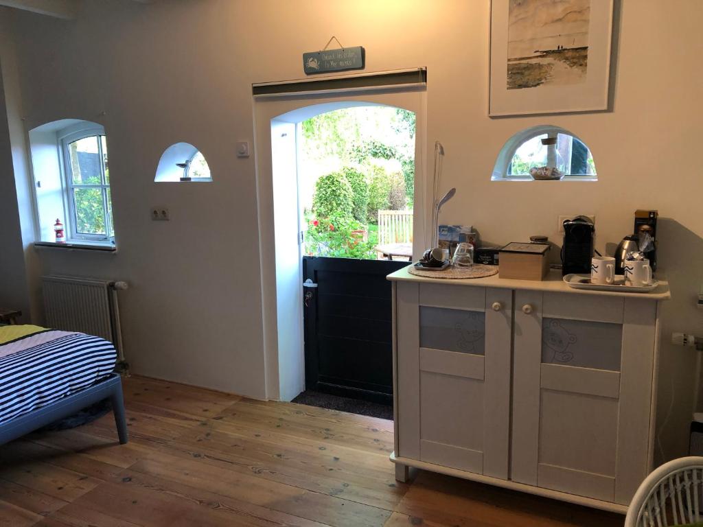 Kuchyň nebo kuchyňský kout v ubytování B&B De Vlasboerderij