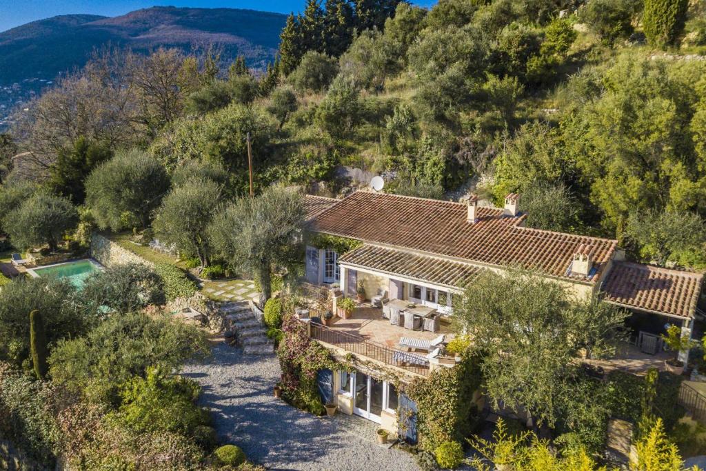 an aerial view of a house with trees at Villa La Lavande in Valbonne