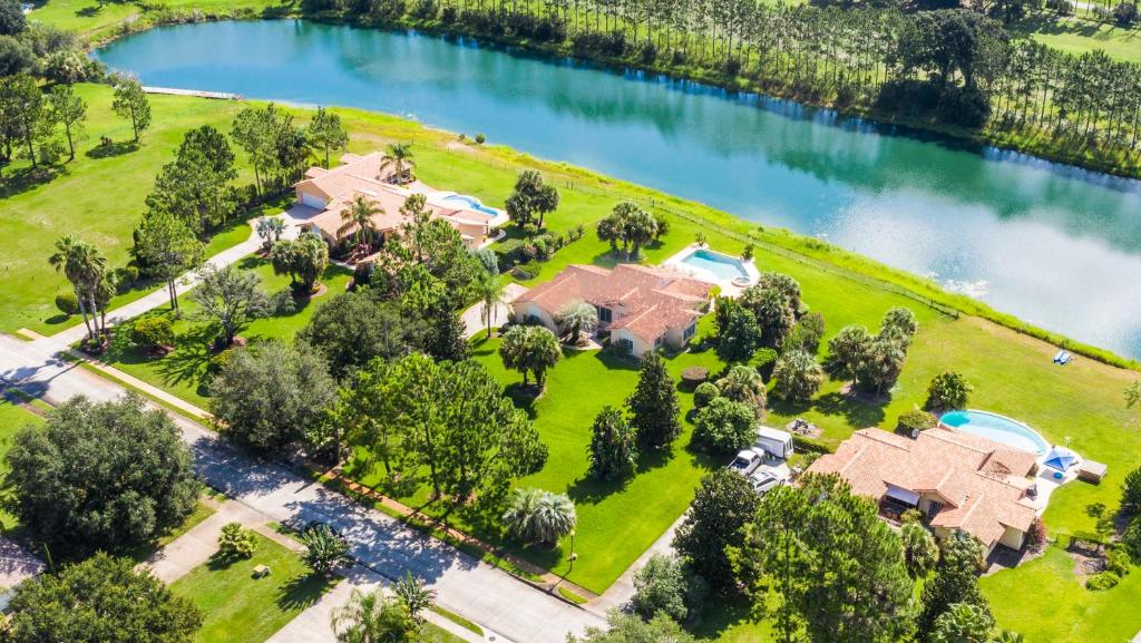 an aerial view of a house with a lake at SWISS 61 - Lake Denise in Clermont