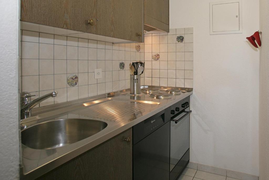 Kuchyň nebo kuchyňský kout v ubytování Baron / Baronesse Apartments