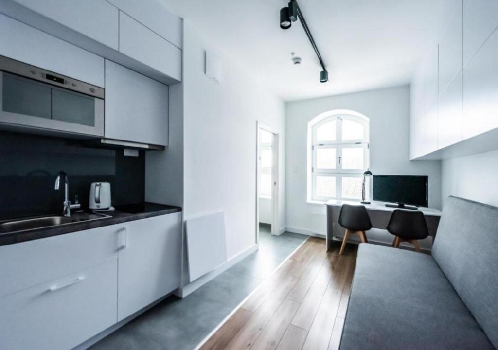 Kuchyňa alebo kuchynka v ubytovaní Apartamenty Do Studzienki 65