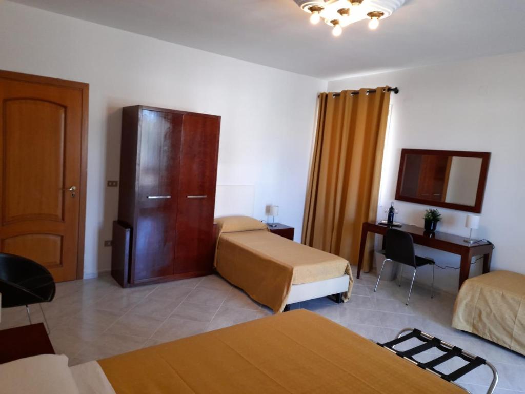Posteľ alebo postele v izbe v ubytovaní Siracusa breakfast & rooms