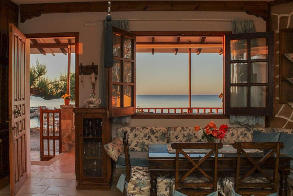 a living room with a couch and a table at Villa Limnioni in Archangelos