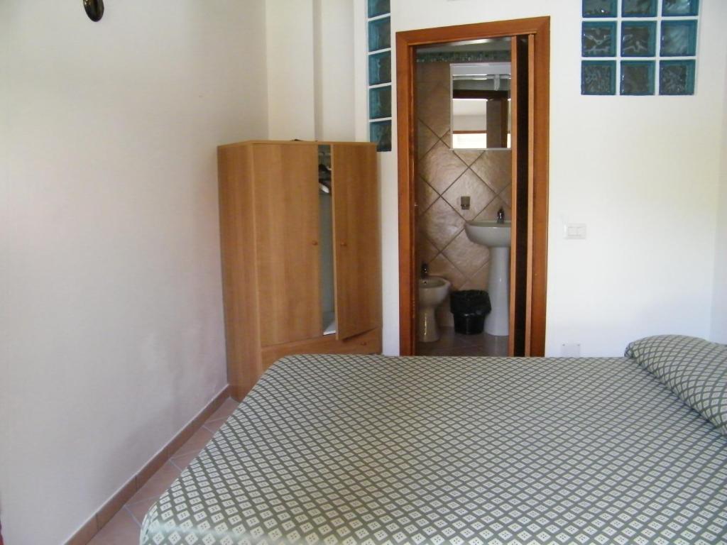 Postel nebo postele na pokoji v ubytování Hotel Villaggio Tabù