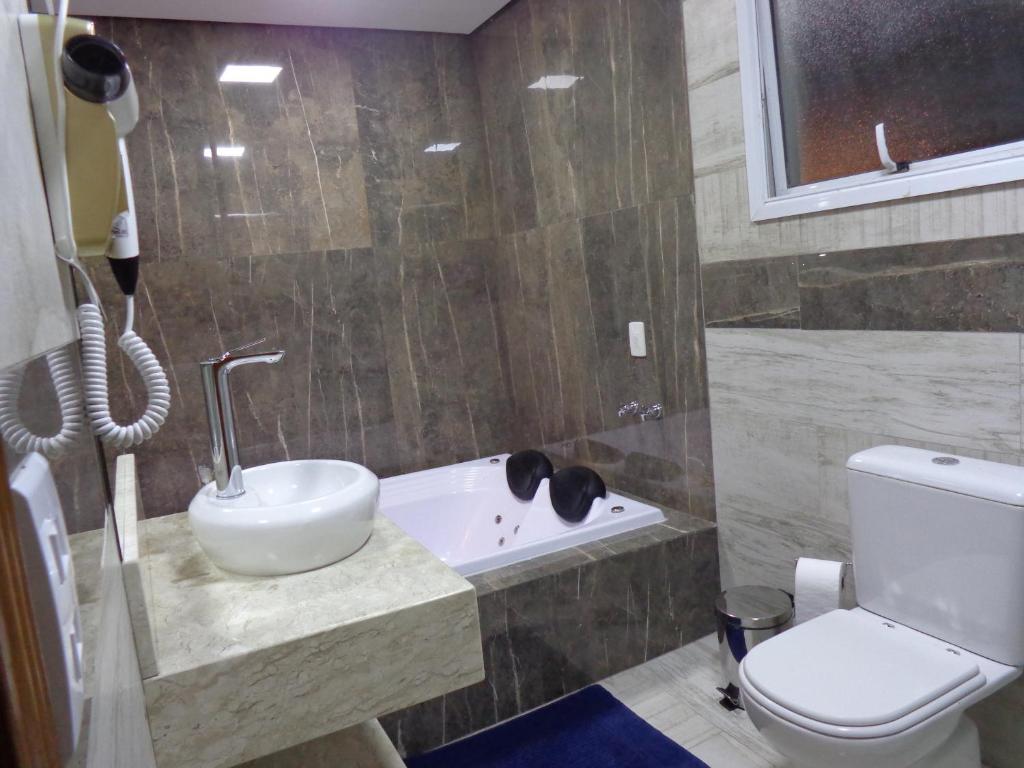  Monte Verde Inn Apartamentos&Suites com Hidromassagem dupla