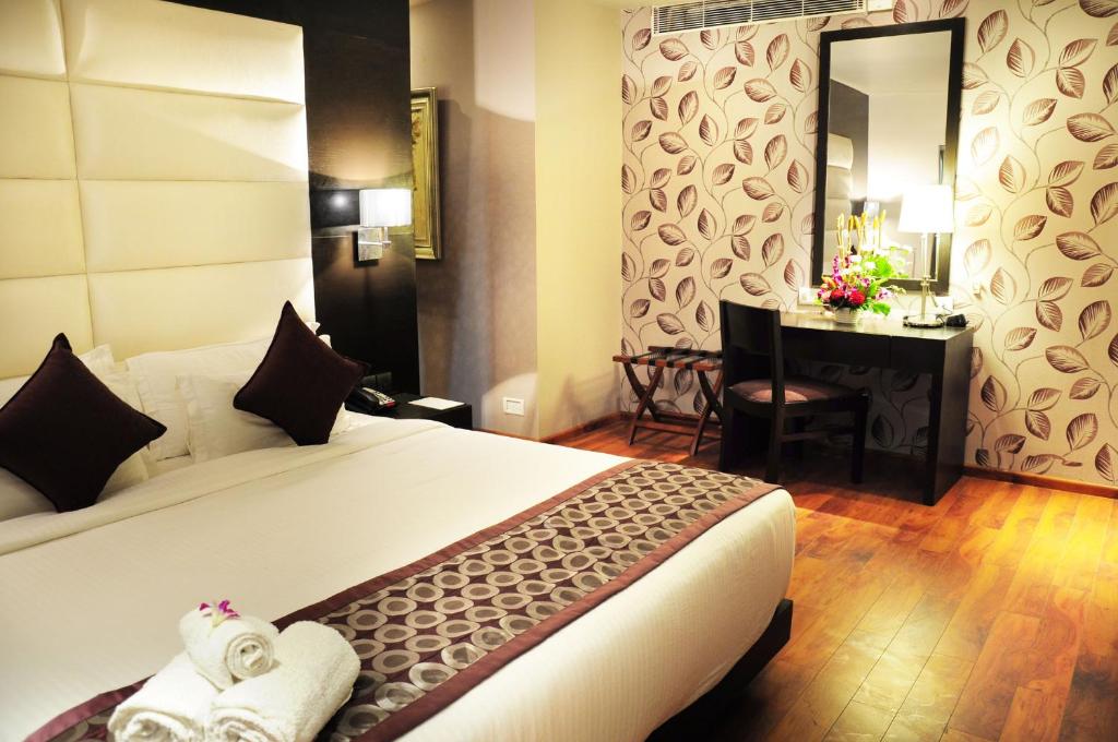 Postel nebo postele na pokoji v ubytování Hotel Senses