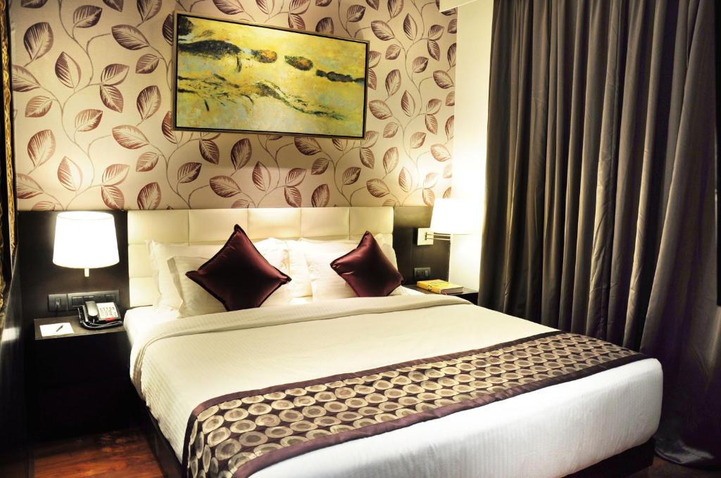 Postel nebo postele na pokoji v ubytování Hotel Senses